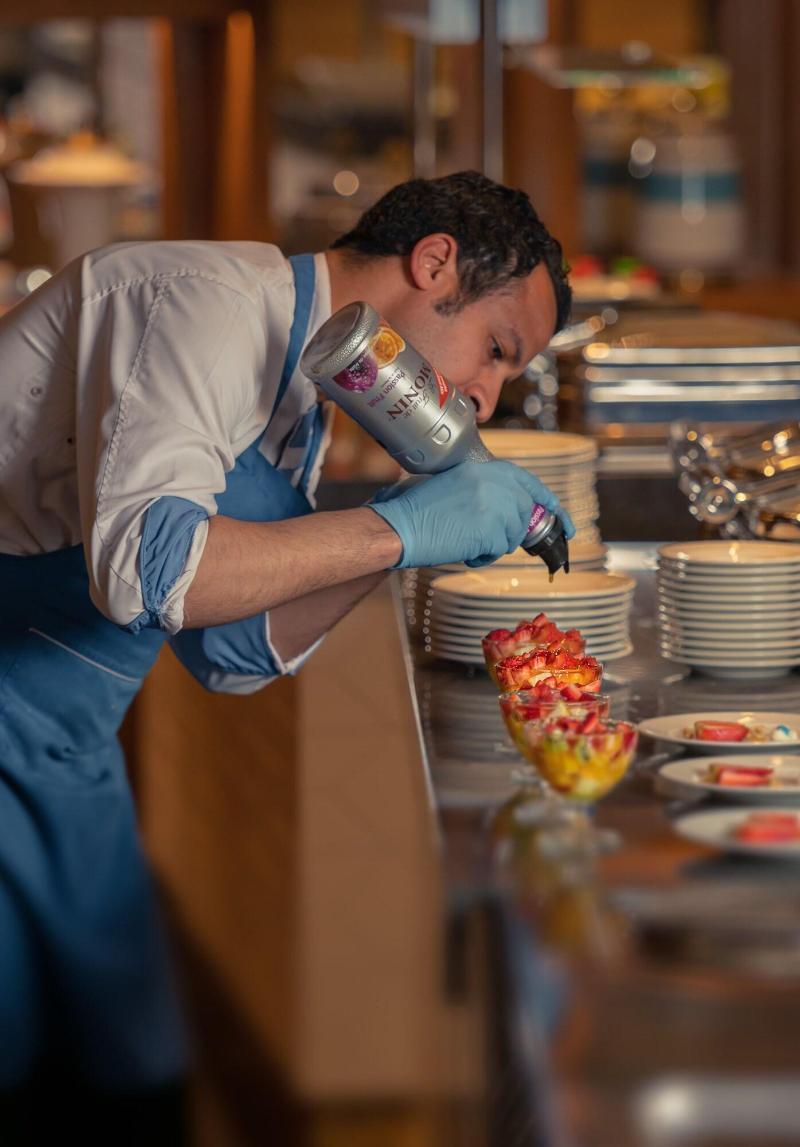 Crystal Inn Hotel - Alamein (Adults Only) El Alamein Luaran gambar A cook using a whipped cream dispenser